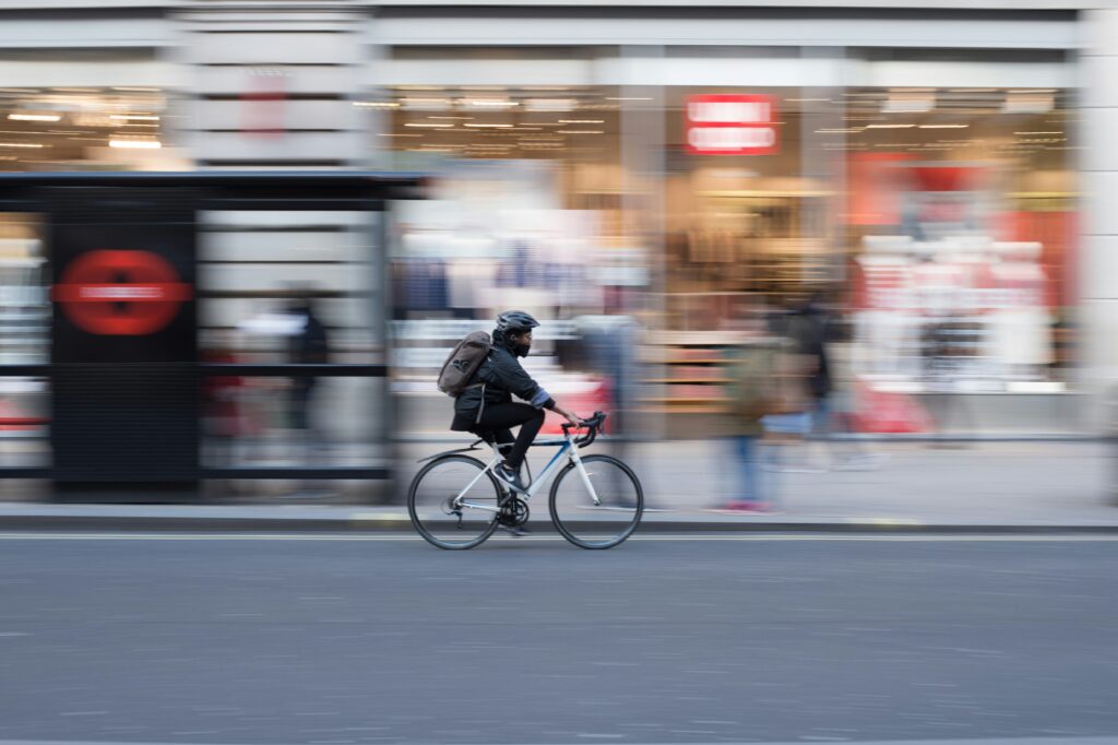 Cyclist navigating dangerous San Francisco traffic — bicycle accident lawyer John J. Roach