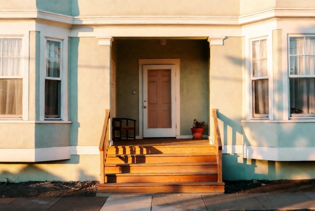 Empty wooden front porch in a residential Daly City neighborhood — California dog bite liability law strict liability under Civil Code 3342