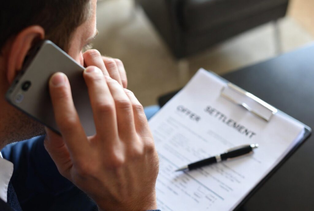 Injury victim pressured by an insurance adjuster phone call