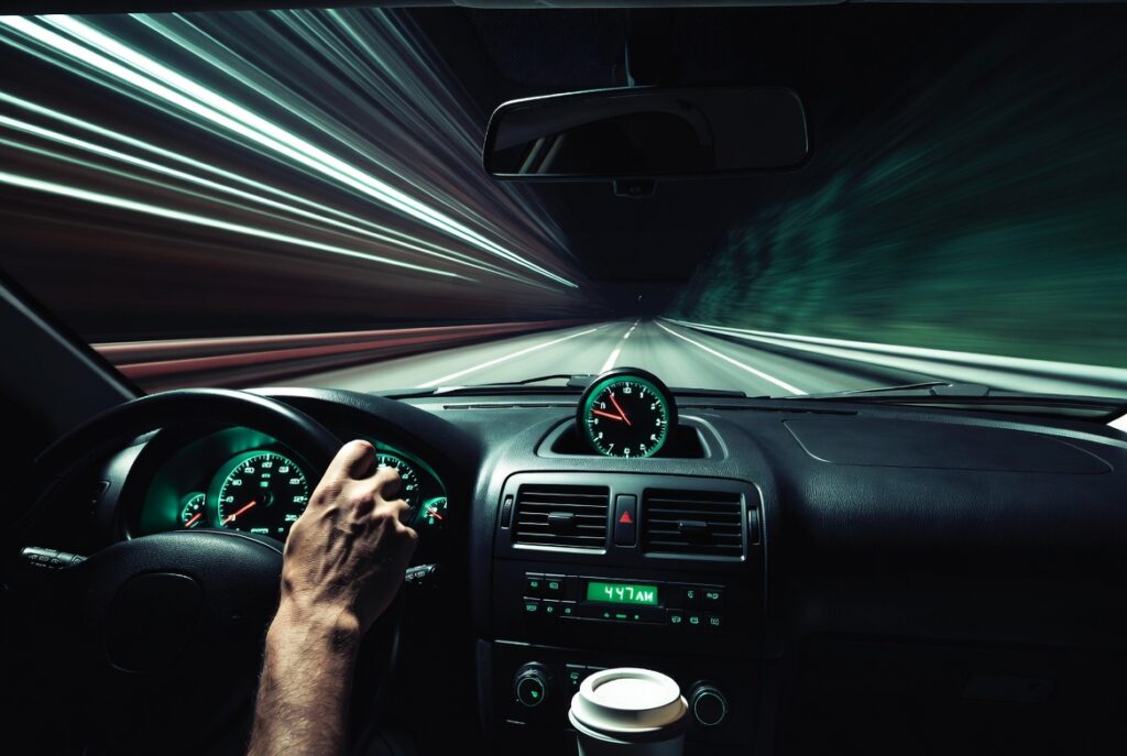 Car dashboard clock reading early morning hours, illustrating driver fatigue and drowsy driving risk on California roads