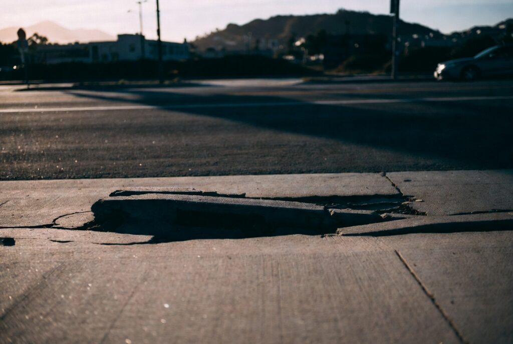 Cracked and lifted San Francisco sidewalk showing a dangerous condition of public property
