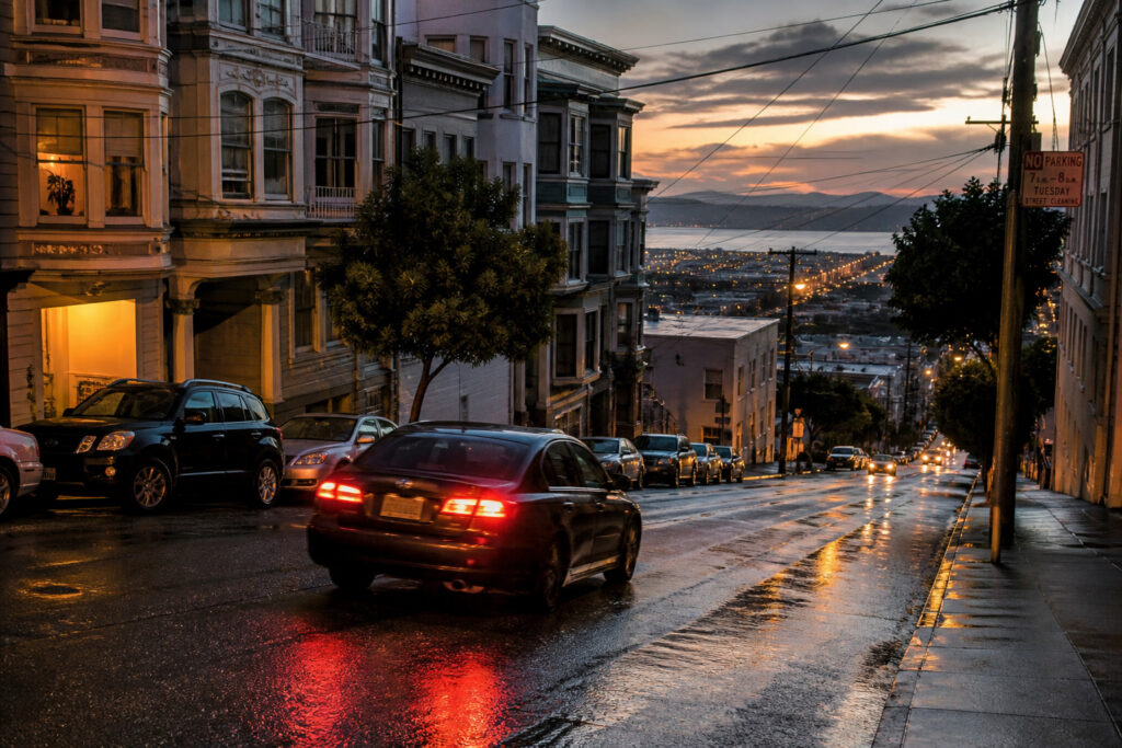 Steep wet San Francisco hill street at dusk — spinal injuries often happen in crashes on the city's grades
