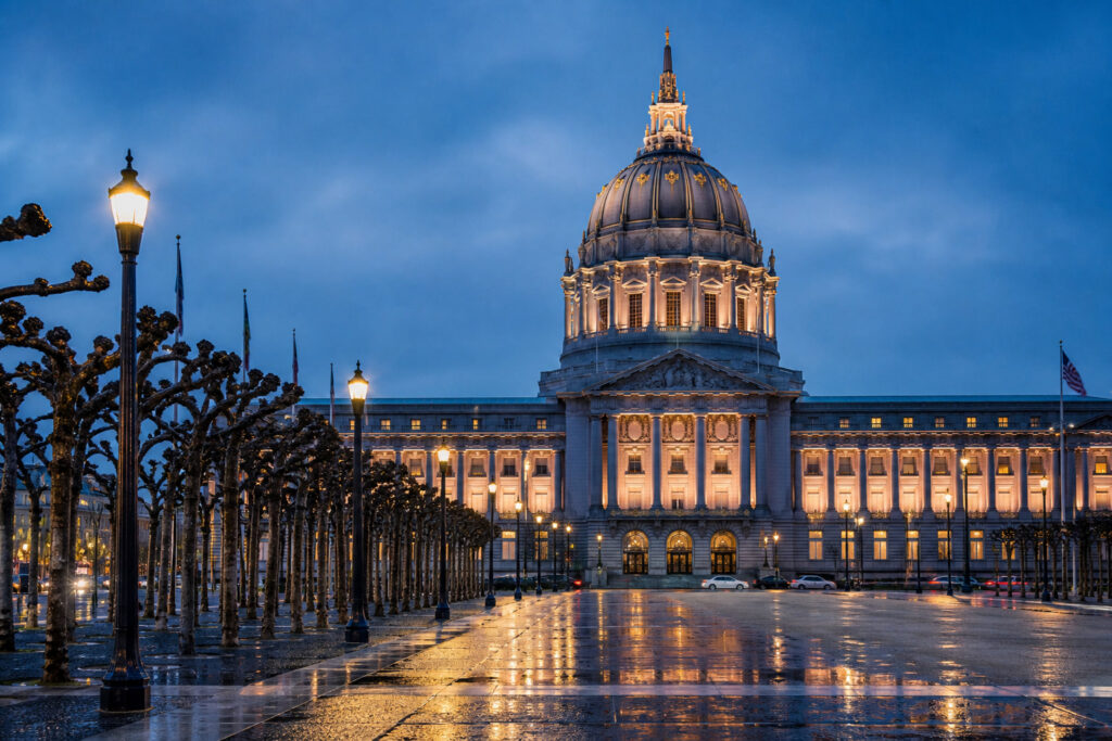 San Francisco City Hall at dusk with wet Civic Center Plaza — where wrongful death claims are litigated